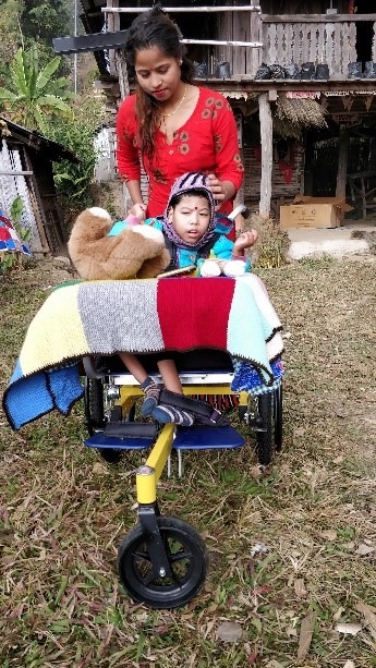 Child with mother in wheelchair